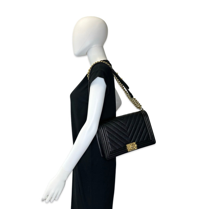 CHANEL: Chevron Quilted Caviar New Medium Boy Bag