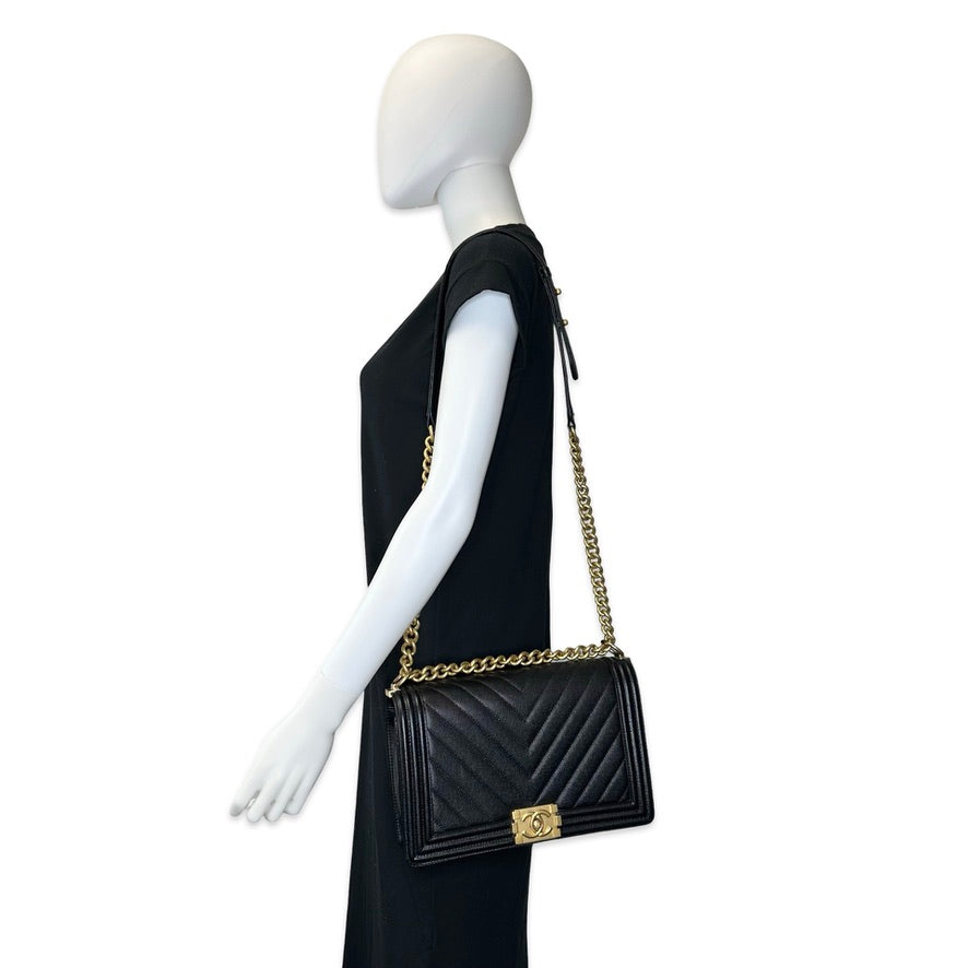 CHANEL: Chevron Quilted Caviar New Medium Boy Bag