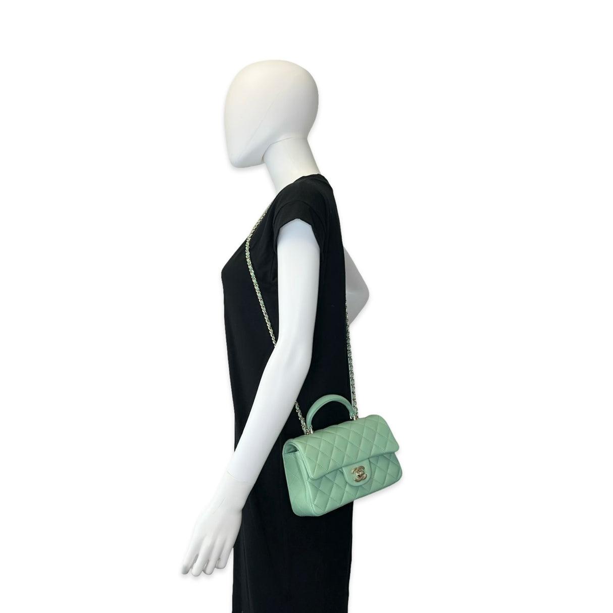 CHANEL: Quilted Lambskin Mini Top Handle Flap bag