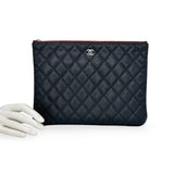 CHANEL: Quilted Caviar Large O Case Zip Pouch