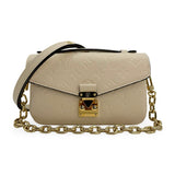 LOUIS VUITTON: Monogram Empreinte Pochette Metis East West