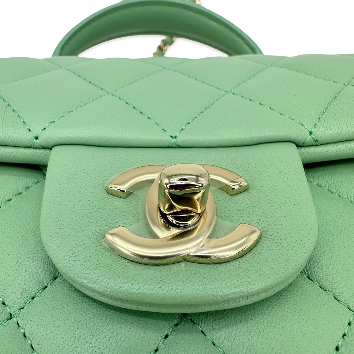 CHANEL: Quilted Lambskin Mini Top Handle Flap bag