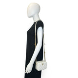 CHANEL: Quilted Caviar Twist Your Buttons Mini Vanity Case
