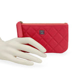 CHANEL: Quilted Caviar Small O Case Zip Pouch