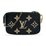 LOUIS VUITTON: Monogram Empreinte Bicolor Mini Pochette Accessoires