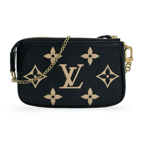 LOUIS VUITTON: Monogram Empreinte Bicolor Mini Pochette Accessoires