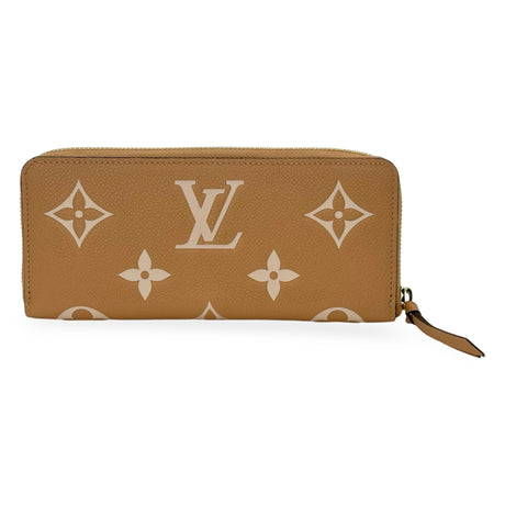 LOUIS VUITTON: Bicolor Monogram Empreinte Clemence Wallet