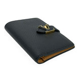 LOUIS VUITTON: Taurillon Capucines Vertical Compact Wallet