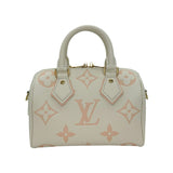 LOUIS VUITTON: Bicolor Monogram Empreinte Speedy Bandouliere 20