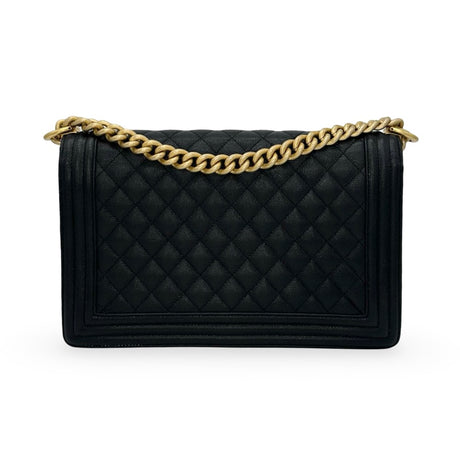 CHANEL: Quilted Caviar Medium Boy Bag