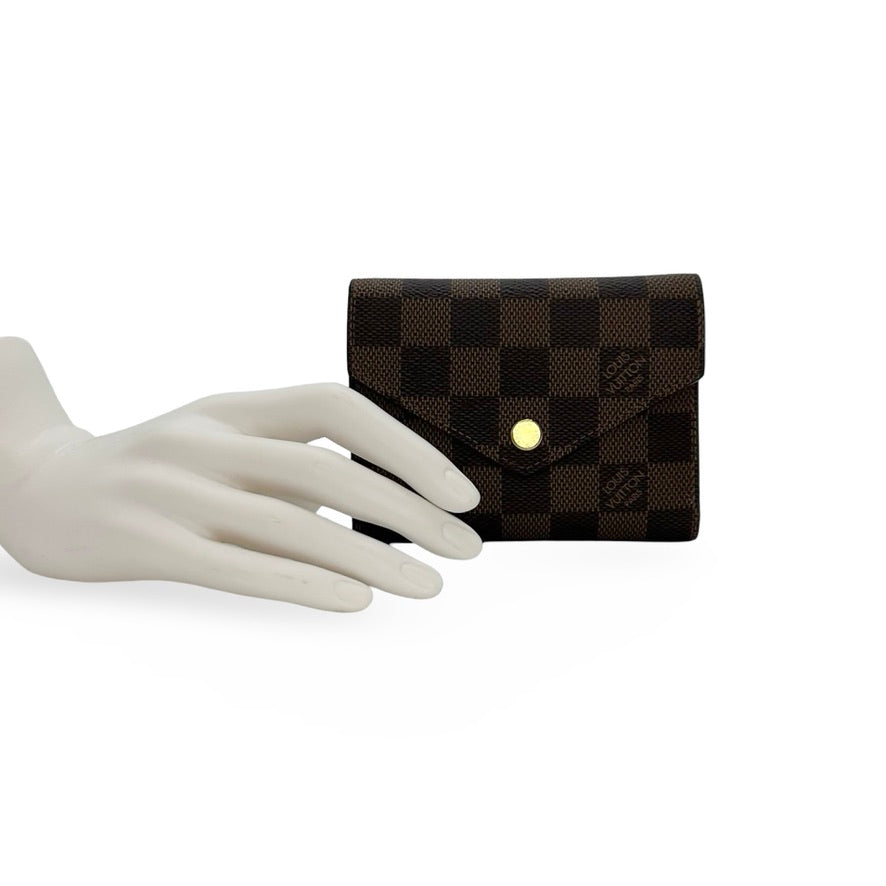 LOUIS VUITTON: Damier Ebene Victorine Wallet