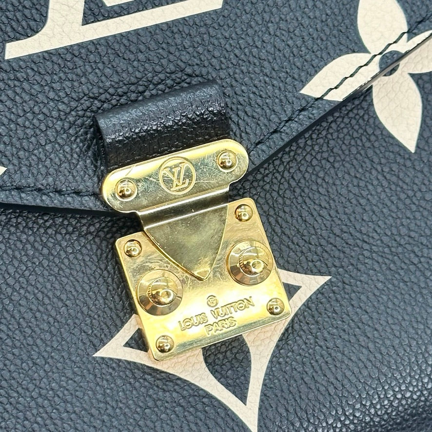 LOUIS VUITTON: Monogram Empreinte Bicolor Pochette Metis