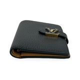 LOUIS VUITTON: Taurillon Capucines Vertical Compact Wallet