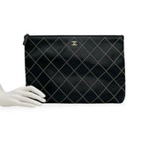 CHANEL: Quilted Studded Calfskin Large O Case Zip Pouch