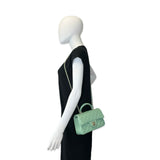 CHANEL: Quilted Lambskin Mini Top Handle Flap bag