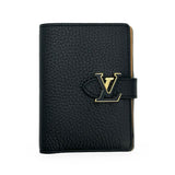 LOUIS VUITTON: Taurillon Capucines Vertical Compact Wallet