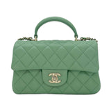 CHANEL: Quilted Lambskin Mini Top Handle Flap bag