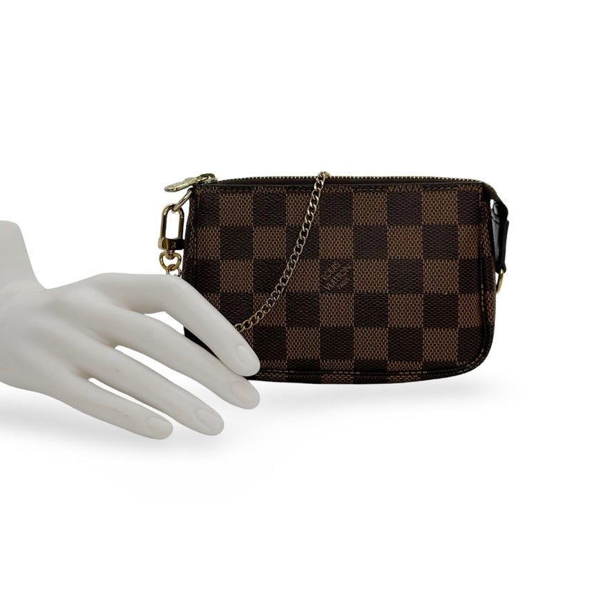 LOUIS VUITTON: Damier Ebene Mini Pochette Accessoires