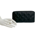 Monogram Embossed Lambskin Coussin Zippy Wallet