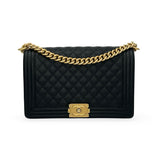 CHANEL: Quilted Caviar Medium Boy Bag