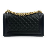 CHANEL: Quilted Caviar Old Medium Boy Bag