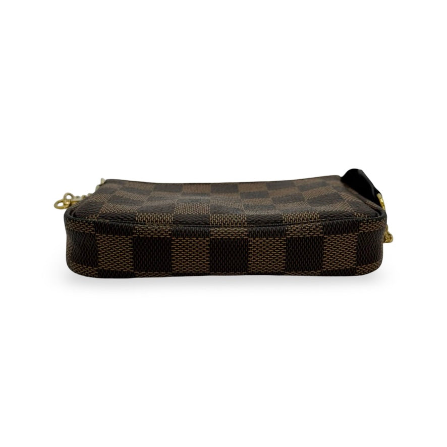 LOUIS VUITTON: Damier Ebene Mini Pochette Accessoires