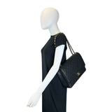 CHANEL: Quilted Caviar Maxi Classic Double Flap