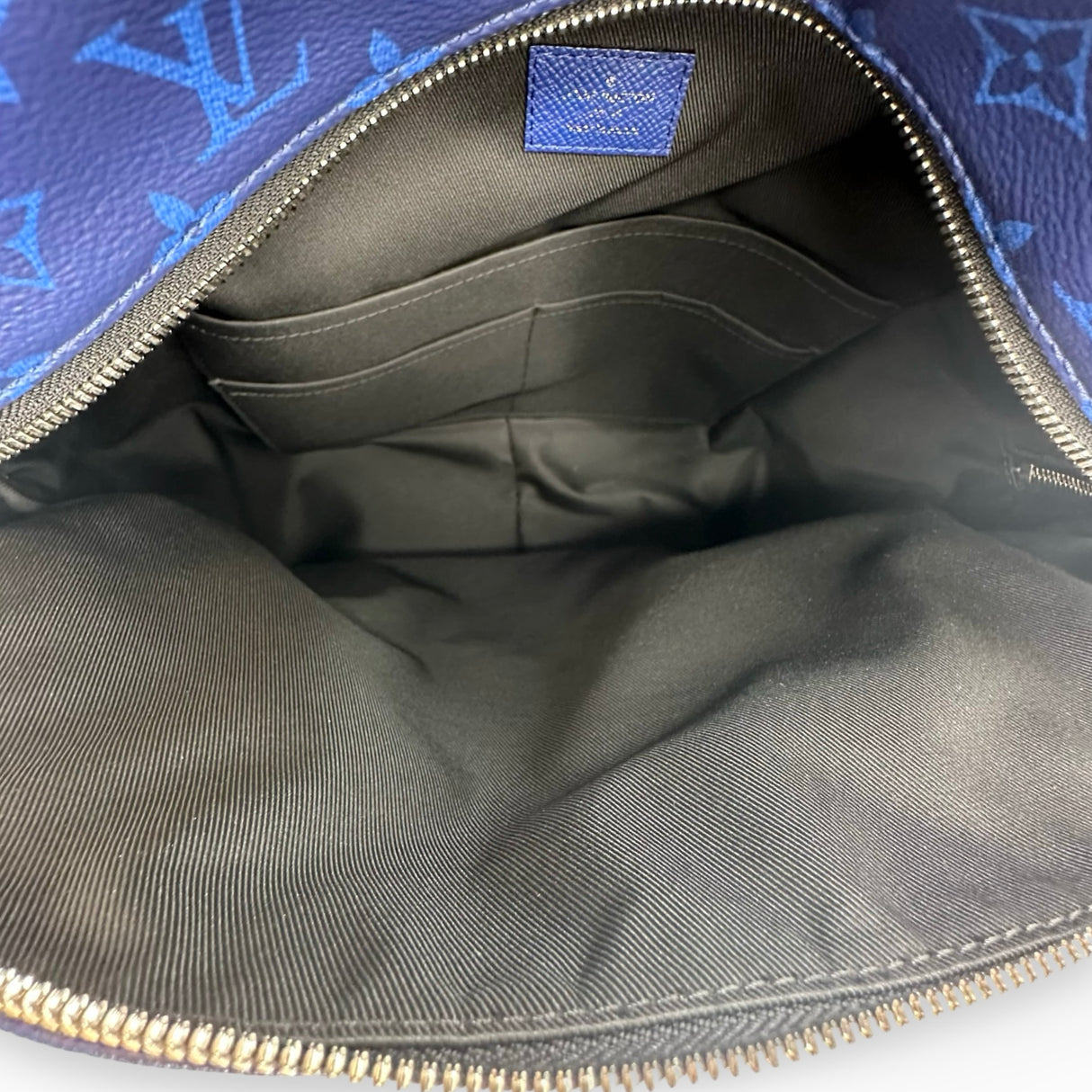 LOUIS VUITTON: Monogram Taiga Discovery PM Backpack