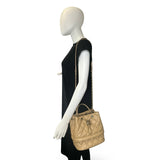 CHANEL: Quilted Caviar Rolled Up Drawstring Bucket Bag