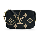 LOUIS VUITTON: Monogram Empreinte Bicolor Mini Pochette Accessoires
