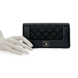 CHANEL: Quilted Caviar Mademoiselle Flap Wallet